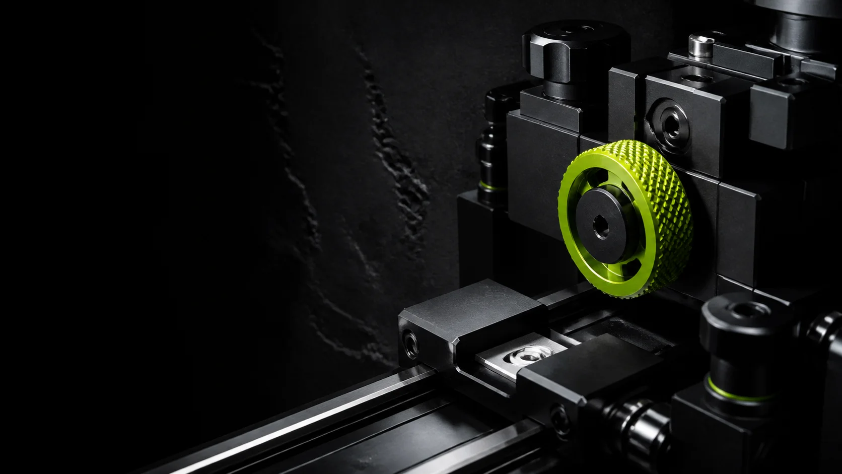Fictional black anodised industrial jig with a chartreuse adjustment wheel